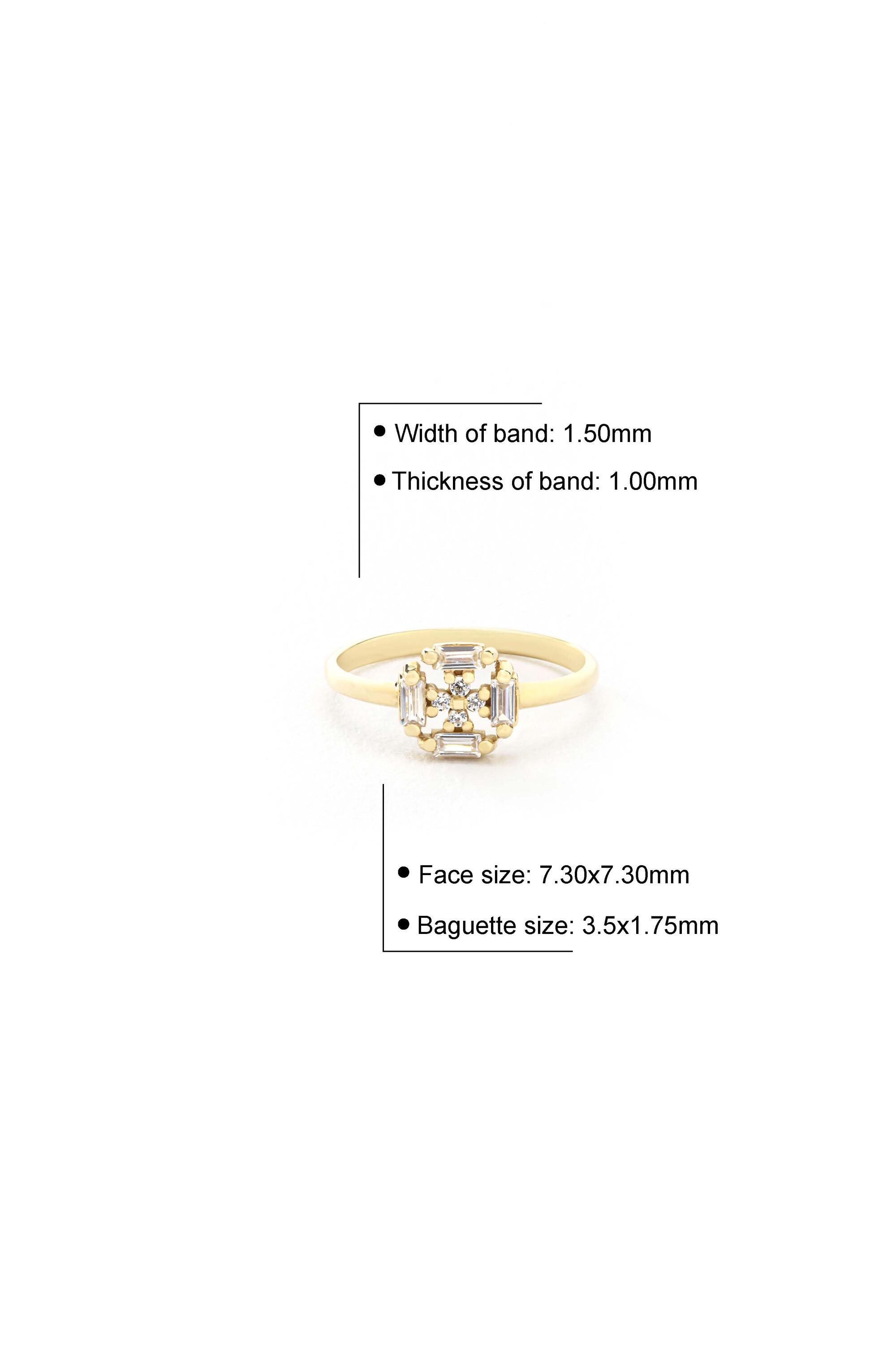 a gold ring with a large central gemstone surrounded by smaller gemstones. The ring has a width of 1.50mm and a thickness of 1.00mm. The face size is 7.30x7.30mm, and the baguette size is 3.5x1.75mm.