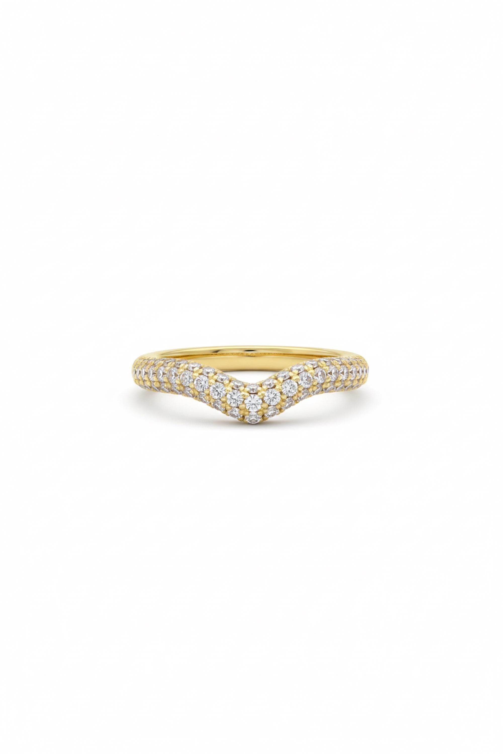 May include: A gold-colored ring with a curved design, encrusted with small, sparkling white gemstones. The ring's band is a solid gold color, and the gemstones are closely set along the top curve. The ring is set against a white background.