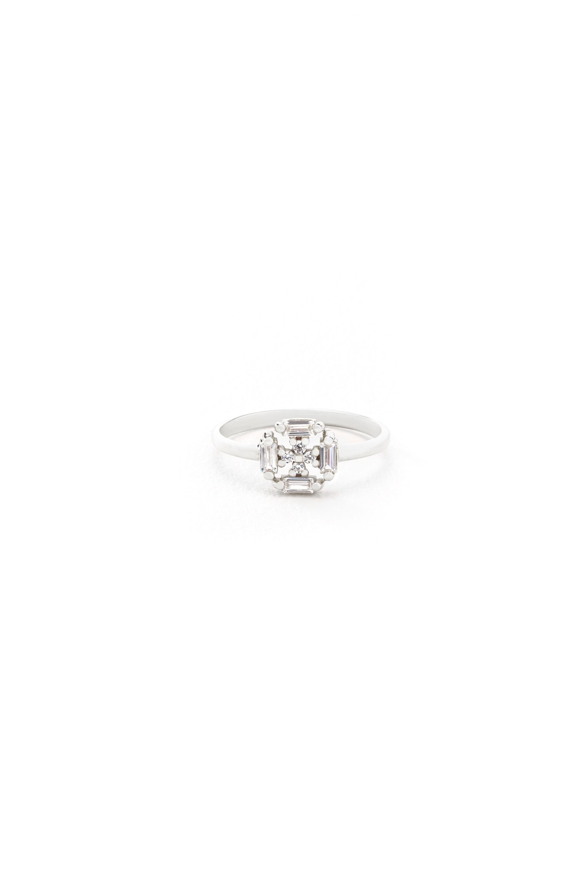A white diamond ring with a large central diamond set in a band.