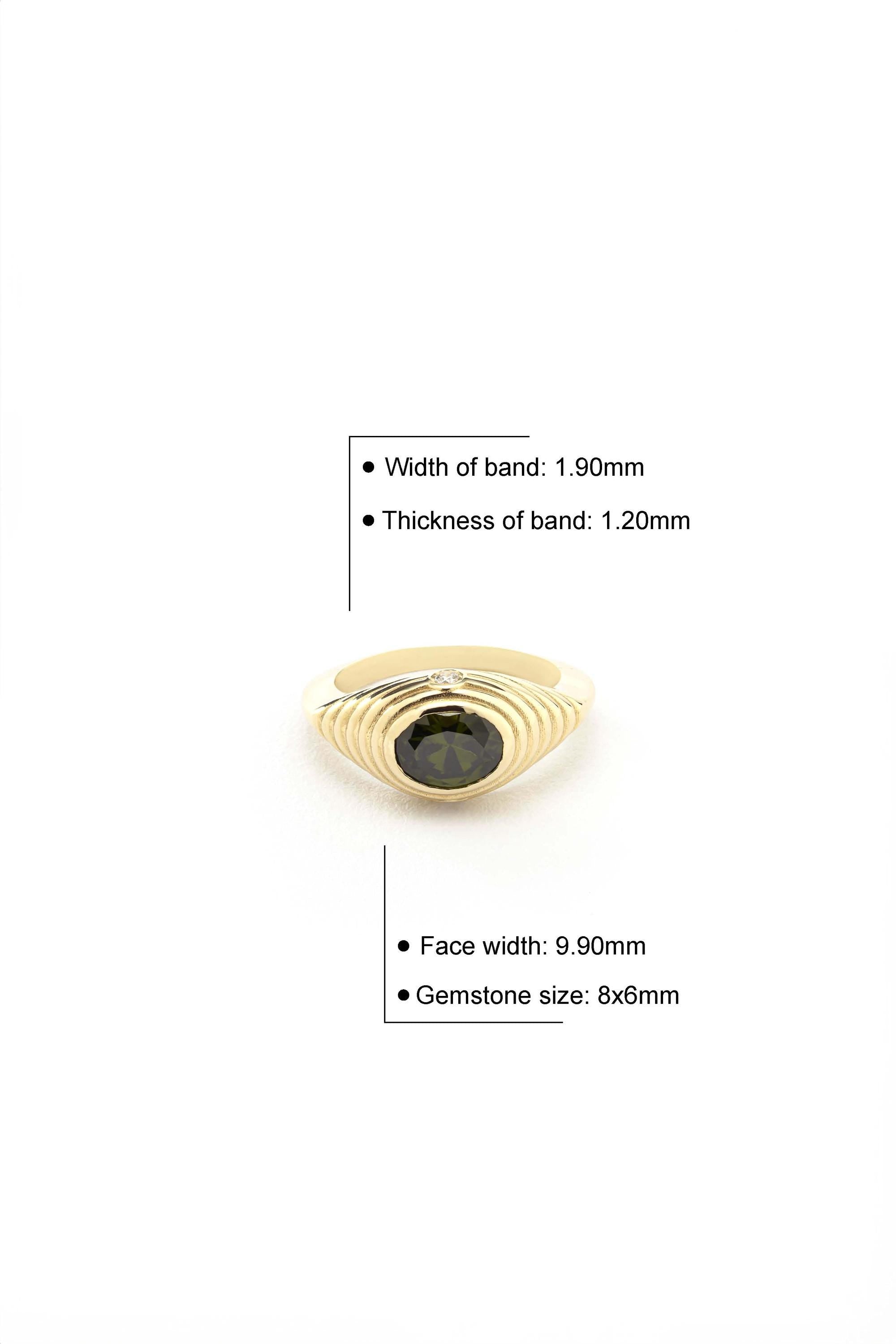 a gold ring with a large green gemstone set in the center. The ring has a width of 1.90mm and a thickness of 1.20mm. The face width of the ring is 9.90mm, and the gemstone size is 8x6mm.